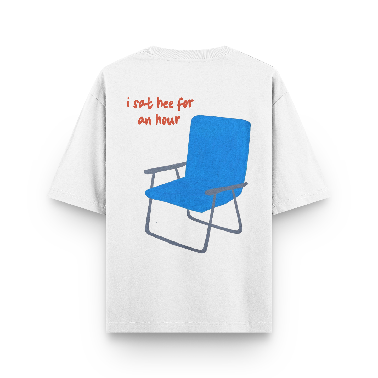 Oversized white t-shirt with blue folding chair and red text “I sat here for an hour”