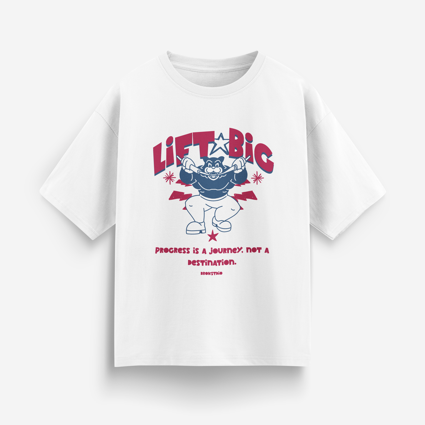 White oversized t-shirt with cartoon muscular character and bold red text “LIFT BIG – Progress is a journey, not a destination”