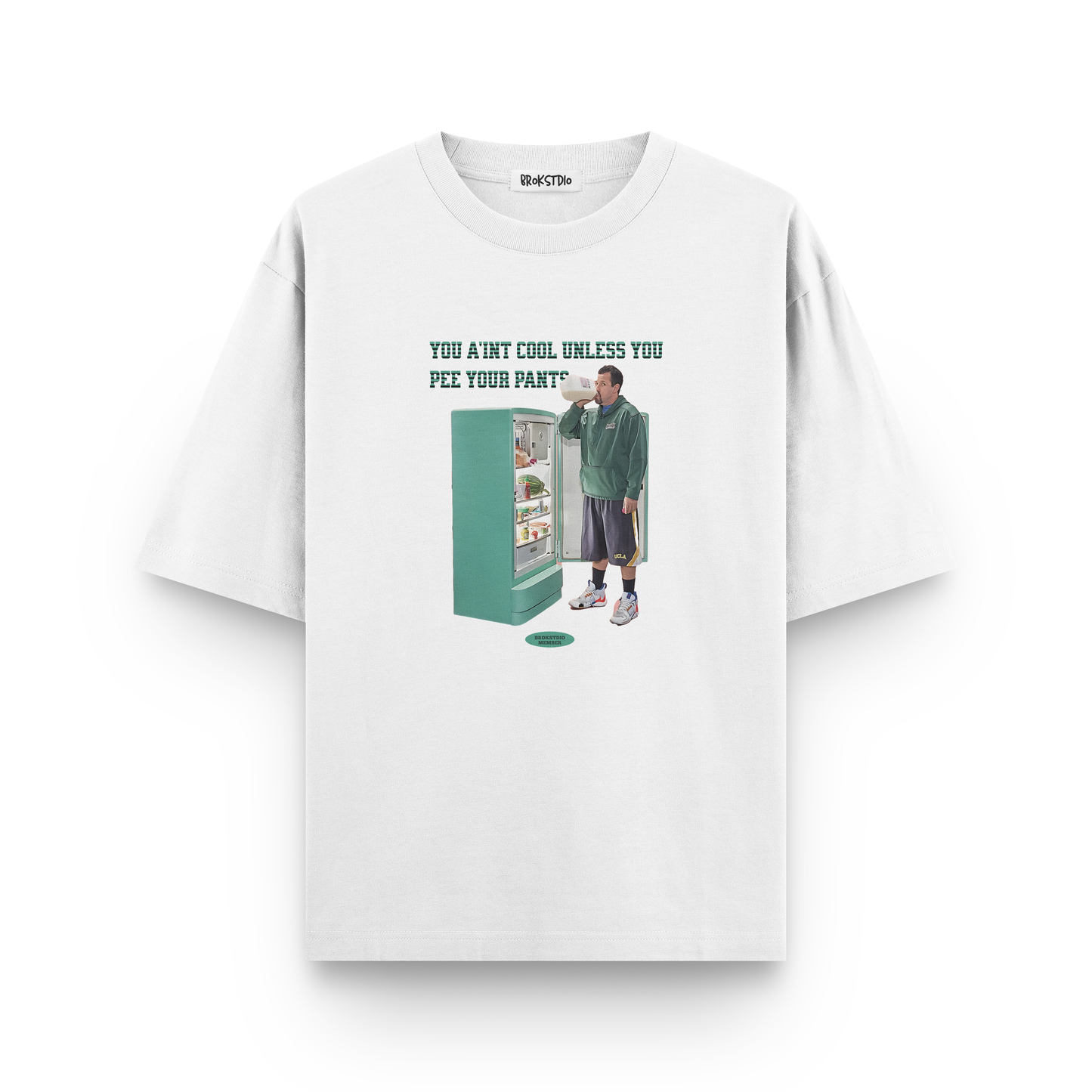 White oversized t-shirt with Adam Sandler meme and text “You ain’t cool unless you pee your pants”